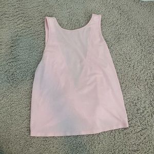 Light pink lulu tank with open back and twist